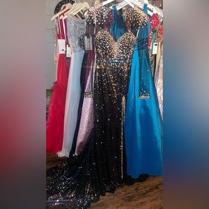 Panoply size 4 long sleeve, mermaid fit formal gown. Black with silver underline